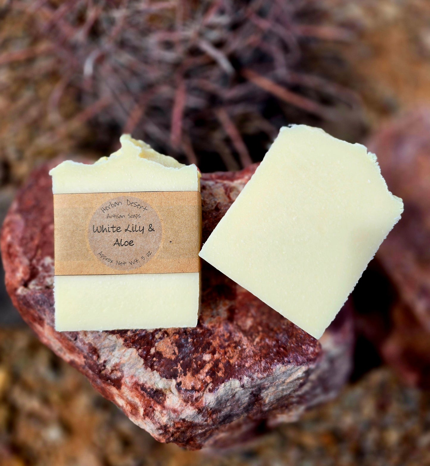 Two handmade tallow soap bars featuring white lily and aloe fragrance, crafted with grass-fed beef tallow, shea butter, and olive oil for deep hydration and gentle cleansing.