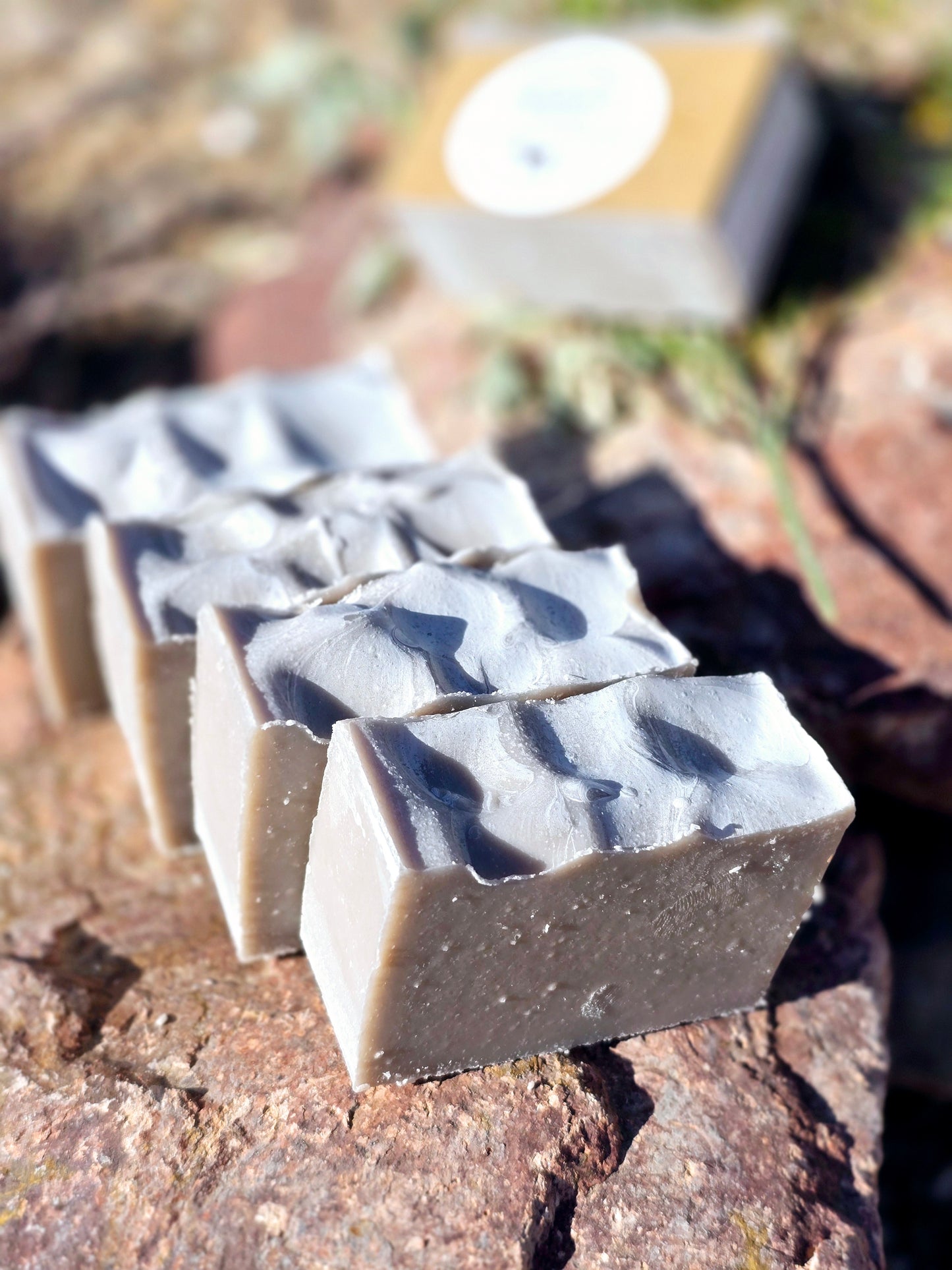 Handmade goat milk soap bar infused with patchouli essential oil, crafted with grass-fed beef tallow, organic shea butter, and avocado oil for deep hydration and gentle cleansing.