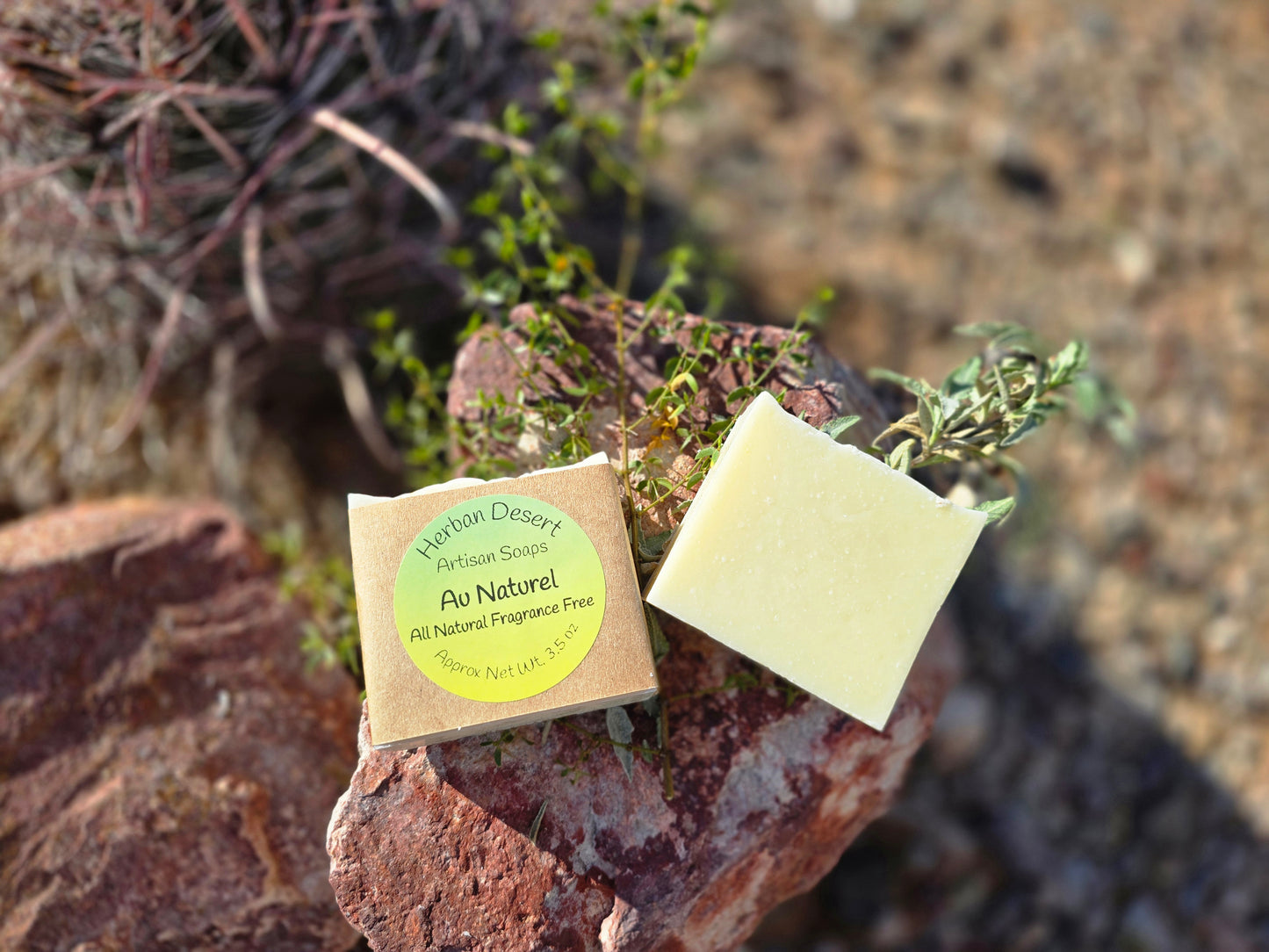 Handmade Au Naturel soap bar featuring a creamy white swirl design, crafted with lard, shea butter, avocado oil, and olive oil for gentle, moisturizing care.