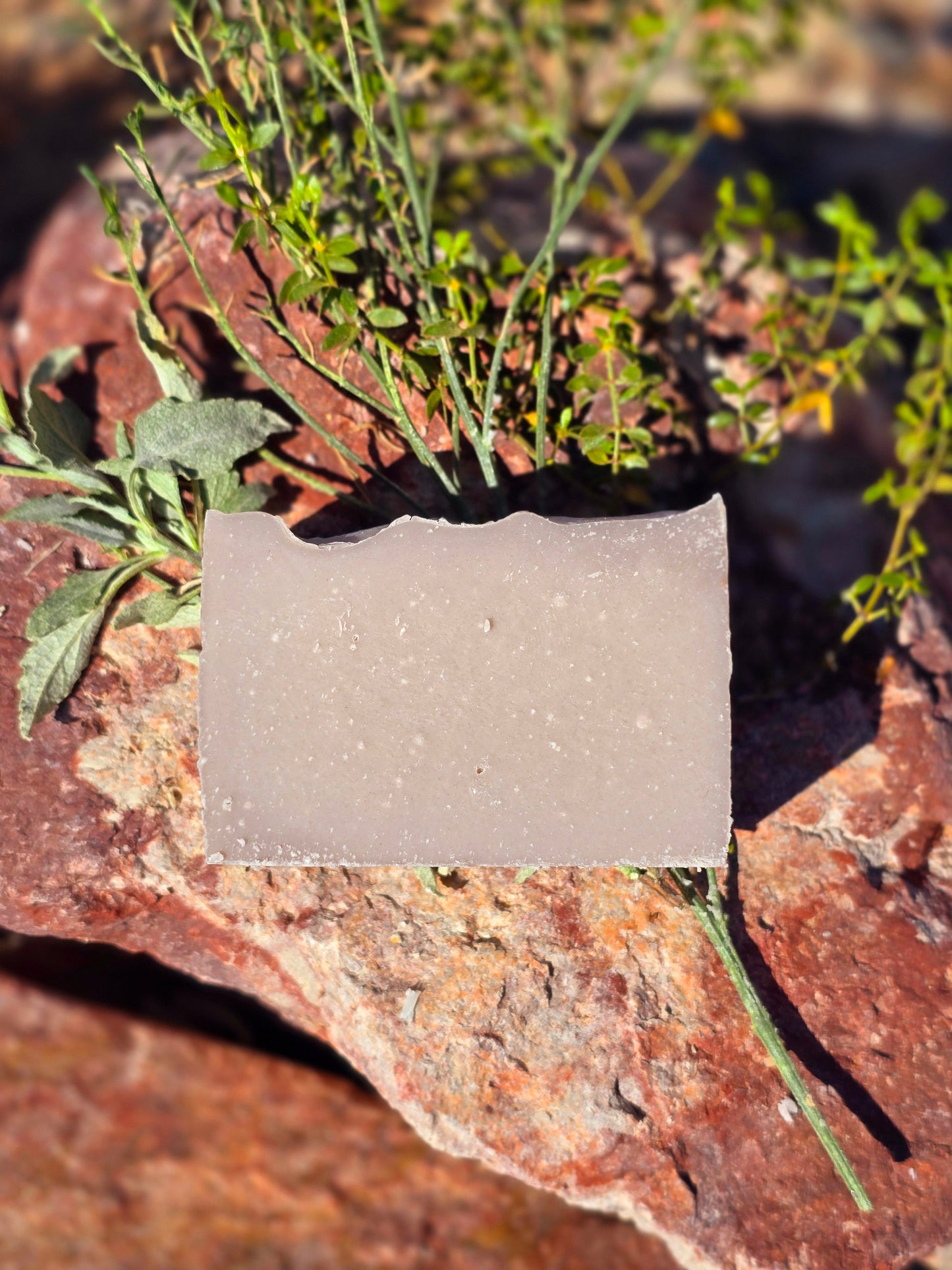 Handmade goat milk soap bar infused with patchouli essential oil, crafted with grass-fed beef tallow, organic shea butter, and avocado oil for deep hydration and gentle cleansing.
