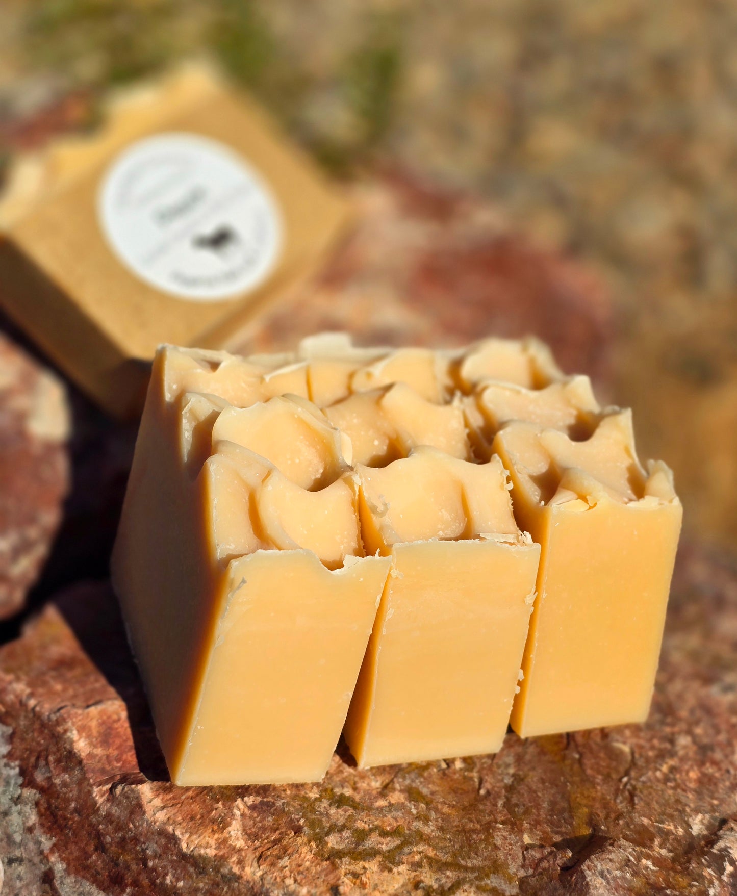 Handmade goat milk soap bar infused with peach fragrance, crafted with grass-fed beef tallow, organic shea butter, and avocado oil for deep hydration and gentle cleansing.