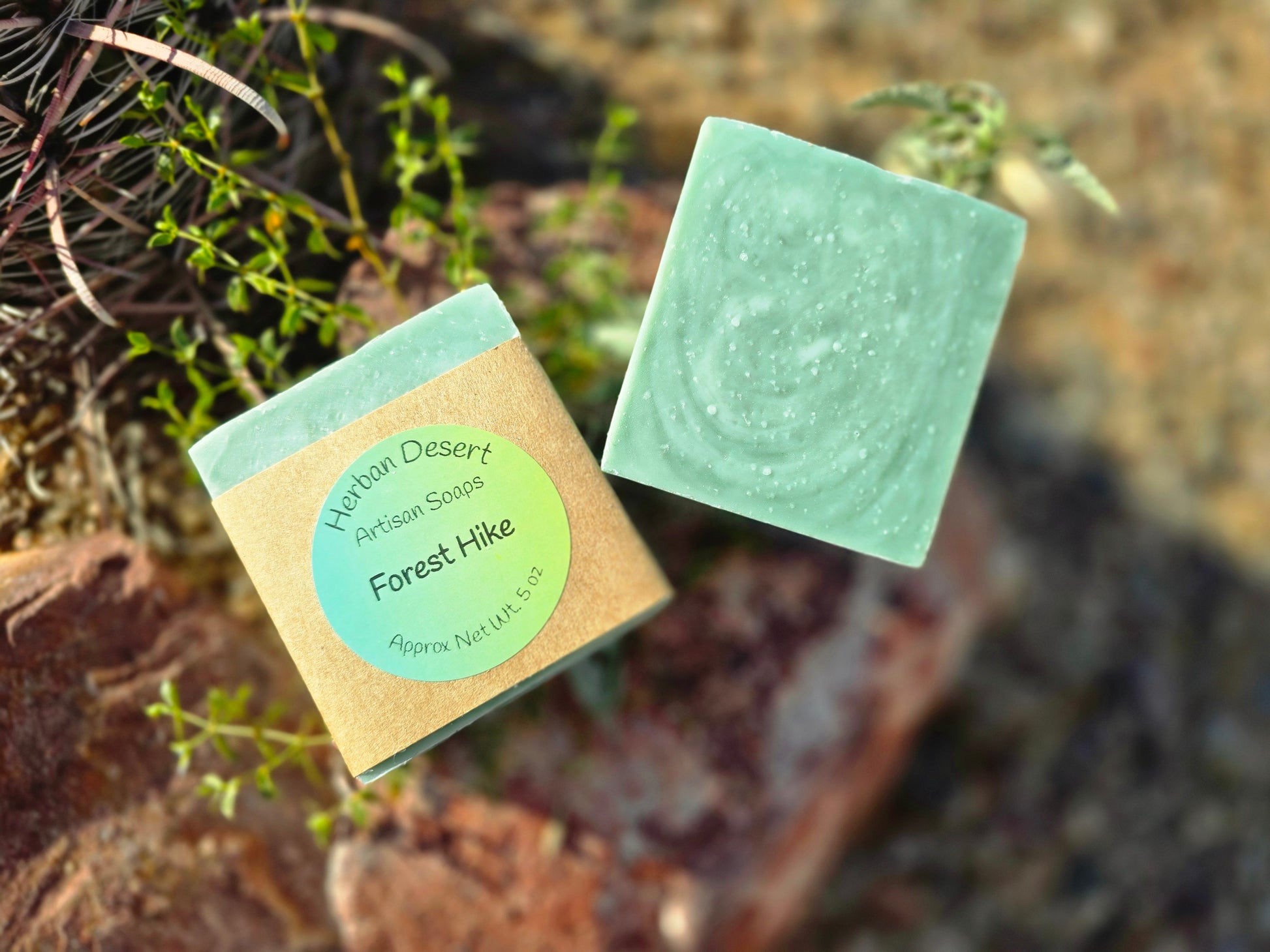 Two bars of our lard based soap, forest hike. This artisan soap has a woodsy, pine and forest scent. The coloration is a dark green with a lighter green swirled in.