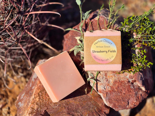 Handmade tallow soap bar featuring a sweet strawberry scent and pink coloration, crafted with grass-fed beef tallow and nourishing oils for deep hydration